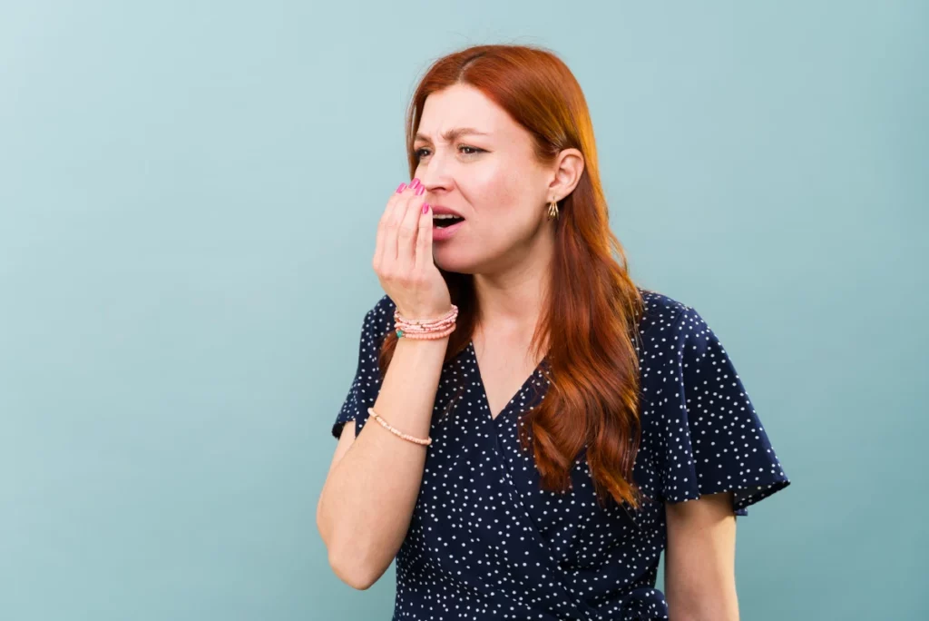 Woman with bad breath (halitosis)